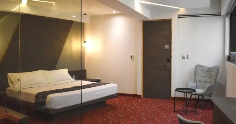 Cama de la suite del Uniko Living Roma CDMX