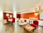 Suite Principal El Sueño Hotel & Spa Puebla con mesas y sofás
